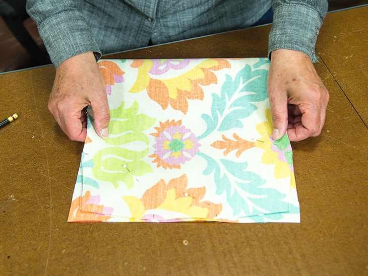 Fold over fabric. Use as a guide to trim the remaining two corners.